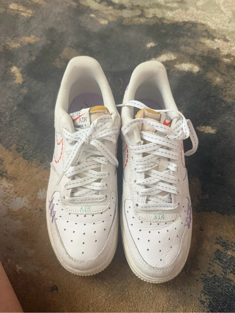 Nike White Low-Top Sneakers with Purple Heel and Orange Stitching